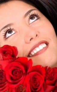 Photo of a beautiful woman with red roses