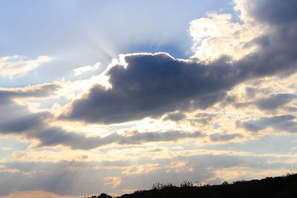 Light Bursting from Behind the Clouds