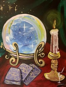 Crystal Ball with Tarot Cards and Candle on a Table