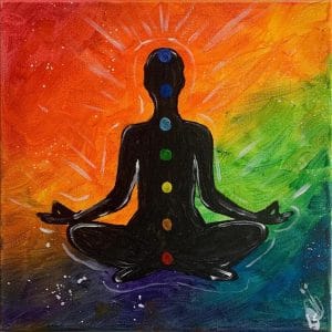 Silhouette of person on rainbow background with rainbow energy centers